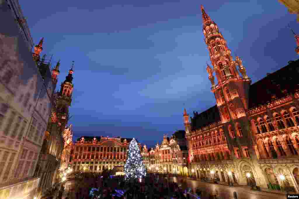 An illuminated Christmas tree is pictured on Brussels' Grand Place during a light show as part as "Winter Wonders" festivities, including a Christmas market and other events, in central Brussels, Belgium.