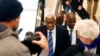 Former president of the IAAF (International Association of Athletics Federations) Lamine Diack, center, arrives at the Paris courthouse, Jan. 13, 2020.