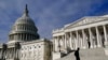 FILE - A man walks past the the U.S. Capitol, Oct. 27, 2021.