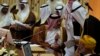 Qatar's Foreign Minister Khalid bin Mohamed Al-Attiyah (L) attends Gulf Cooperation Council (GCC) meeting in Riyadh June 2, 2014. 
