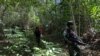 Personel Pos Skofro Baru Satgas Pamtas RI-PNG Yonif 131/Brs melaksanakan patroli wilayah mengecek patok perbatasan MM 2.2, di Skofro Baru Distrik Arso Timur Kab. Keerom, Papua, 22 Oktober 2021. (Courtesy: Pendam XVII/Cenderawasih-Papua)