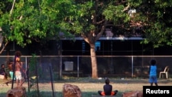 FILE - Children of the Australian Aboriginal community of Ramingining play in East Arnhem Land, located east of the Northern Territory city of Darwin. Judge Greg Borchers has been has been accused of racism towards Indigenous defendants. 