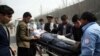 Foreign security personnel and Afghan police arrive at the site of an attack in Kabul, Afghanistan, March 6, 2020. Gunmen attacked a remembrance ceremony for a minority Shi'ite leader, killing more than two dozen people.