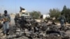 FILE - Afghan forces inspect the site of a U.S. airstrike in Kunduz city, Afghanistan, Oct. 2, 2015. The U.S. has launched several airstrikes across Afghanistan in the past 30 days, a defense official told VOA on July 22, 2021.