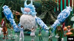 Performers of a fantasy play greet the audience at an outdoor theme park of the newly-opened Wanda Cultural Tourism City or 'Wanda City' in the eastern city of Nanchang in Jiangxi Province, China on May 28, 2016.