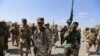 Iran-backed forces allied with Iraqi forces in Ouja, on the southern outskirts of Tikrit, March 26, 2015. The U.S. conditioned its entry into Iraq's battle to retake Tikrit from IS on the withdrawal of Shiite militias from the clearing operation. 