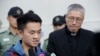 Chan Tong-kai, left, talks to the media as he is released from prison in Hong Kong, Oct. 23, 2019. 