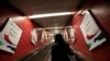 FILE - Advertisements for the Agricultural Bank of China are displayed in a train station in Hong Kong.