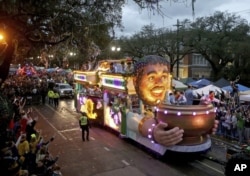FILE: The Officer's Float rolls down Napoleon Avenue as the 1,600 men of Bacchus present their 32-float Mardi Gras parade entitled "Starring Louisiana" on the Uptown route in New Orleans on Sunday, March 3, 2019.