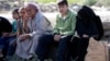 Syrian refugees gather in the village of Salkin after crossing the Syrian-Turkish border, Sept. 5, 2013.