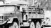 FILE - A truck carrying Soviet troops and trailering weapons moves through a Kabul street in this photograph taken from a monitor of a CBS Evening News broadcast, Dec. 31, 1979.