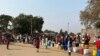 People in Harare forget about social distance to contain coronavirus and get crowded while waiting for free water deliveries from well wishers like Clean City, Aug. 20, 2020. (Columbus Mavhunga/VOA)
