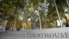 FILE - A U.S. Courthouse is seen in Seattle, Washington, fronted by a tree-lined courtyard, Nov. 6, 2019. Many U.S. immigration courts are temporarily closing or curtailing operations as the nation continues to grapple with the coronavirus pandemic.