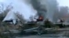 FILE - A Syrian military tank is shown as having caught fire outside Deir Ezzor, Jan. 29, 201.