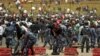 Federal Police assists protestors injured following the burial ceremony of Simegnew Bekele, 
