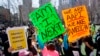 People take part in a rally against hate and confront the rising violence against Asian Americans at Columbus Park in New York's Chinatown on March 21, 2021. 