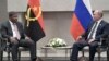 FILE - Angola's President Joao Lourenco, left, speaks to Russia's President Vladimir Putin at the BRICS summit in Johannesburg, South Africa, July 26, 2018. 