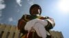 A member of a military marching band attends a ceremony to remember soldiers who died on the first day of the Tigray conflict, outside the city administration office in Addis Ababa, Ethiopia, Nov. 3, 2022.
