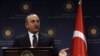 FILE - Turkey's Foreign Minister Mevlut Cavusoglu speaks during a news conference in Ankara, Turkey, Oct. 25, 2019. 
