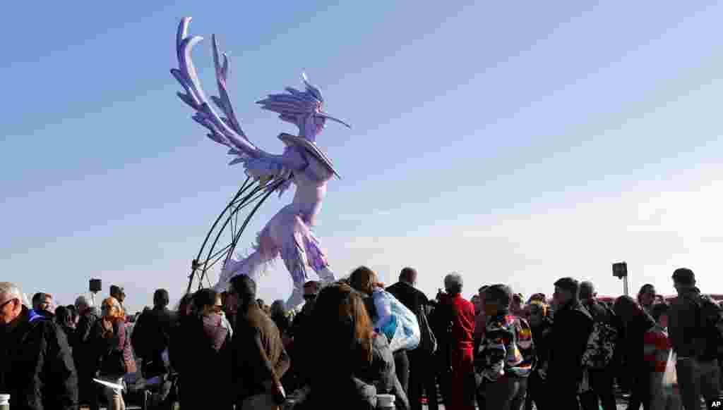 People attend the 132nd Nice carnival parade, in Nice, southeastern France. This year, the Carnival celebrates the &quot;King of Media.&quot;