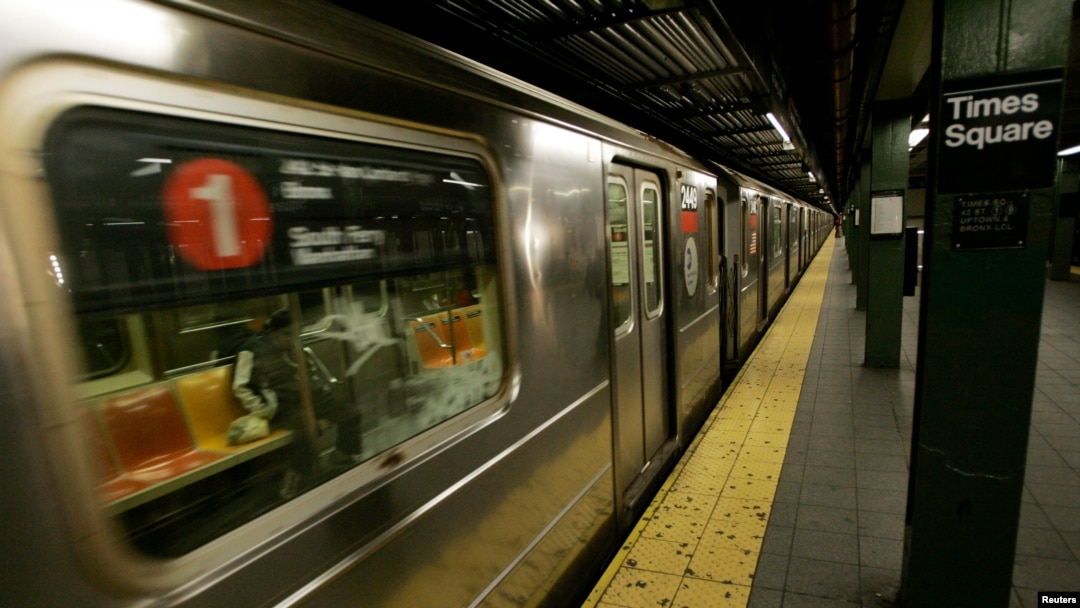 A subway train pulls into the Times Square station.
