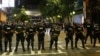 FILE - Police hold their lines in uptown Charlotte during a protest of the police shooting of Keith Scott in Charlotte, North Carolina, Sept. 21, 2016.