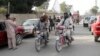 FILE - Taliban fighters ride their motorbikes inside Ghazni city, capital of Ghazni province, west of Kabul, Afghanistan, June 16, 2018. 