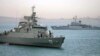 In this picture taken on April 7, 2015 and released by the semi-official Fars News Agency, Iranian warship Alborz (foreground) prepares to leave Iranian waters.
