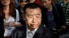 FILE - Human rights activist Jiang Tianyong speaks to journalists outside a hospital after his failed attempt to see blind Chinese activist Chen Guangcheng who is believed to be seeking treatment in Beijing, China, May 2, 2012. The wife of one of China's most prominent human rights campaigners says he has disappeared during a trip to visit relatives of a detained rights lawyer. 