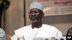 FILE - Nigeria's ex-electoral chief and academic Attahiru Jega attends a meeting with staff from the Independent National Electoral Commission in Abuja, March 17, 2011. 