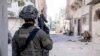 FILE - Israeli soldiers operate in the Gaza Strip on Dec. 14. Israel's Prime Minister Benjamin Netanyahu has said that only the Israel Defense Forces can be trusted to demilitarize Gaza after the war.