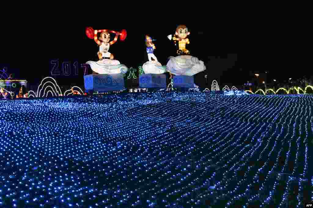 Three monkey-shaped lanterns are displayed at a park in Taipei on the eve of the Lantern Festival, Taiwan.