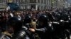 FILE - Police block a street during an unsanctioned rally in the center of Moscow, Russia, July 27, 2019.