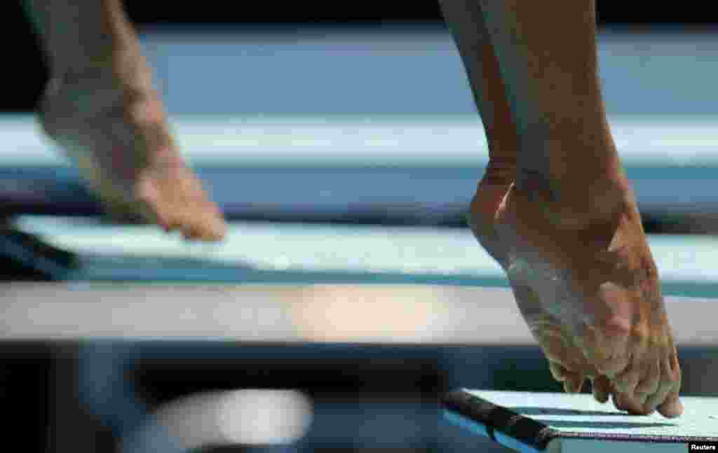 Evgenii Kuznetsov and Llia Zakharov of Russia compete in the men&#39;s 3m synchro springboard preliminary at the 2016 FINA Diving World Cup in Rio de Janeiro. The 2016 FINA Diving World Cup is a test event for Rio 2016 Olympic Games.