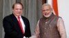 FILE - India's Prime Minister Narendra Modi (R) shakes hands with his Pakistani counterpart Nawaz Sharif before the start of their bilateral meeting in New Delhi May 27, 2014. 