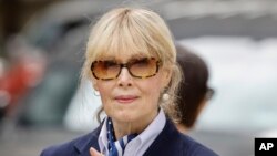 FILE - E. Jean Carroll exits the New York Federal Court after former President Donald Trump appeared in court, Sept. 6, 2024, in New York. 