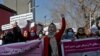 FILE - Afghan women shout slogans during a rally to protest Taliban restrictions on women, in Kabul, Afghanistan, Dec. 28, 2021.