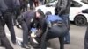 Assailants attacked gay and transgender rights activists and torched a rainbow flag at a small rally in the Ukrainian city of Kharkiv.