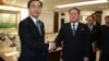 South Korean Unification Minister Cho Myoung-gyon, left, shakes hands with the head of North Korean delegation Ri Son Gwon after their meeting at the Panmunjom in the Demilitarized Zone in Paju, South Korea, Jan. 9, 2018.