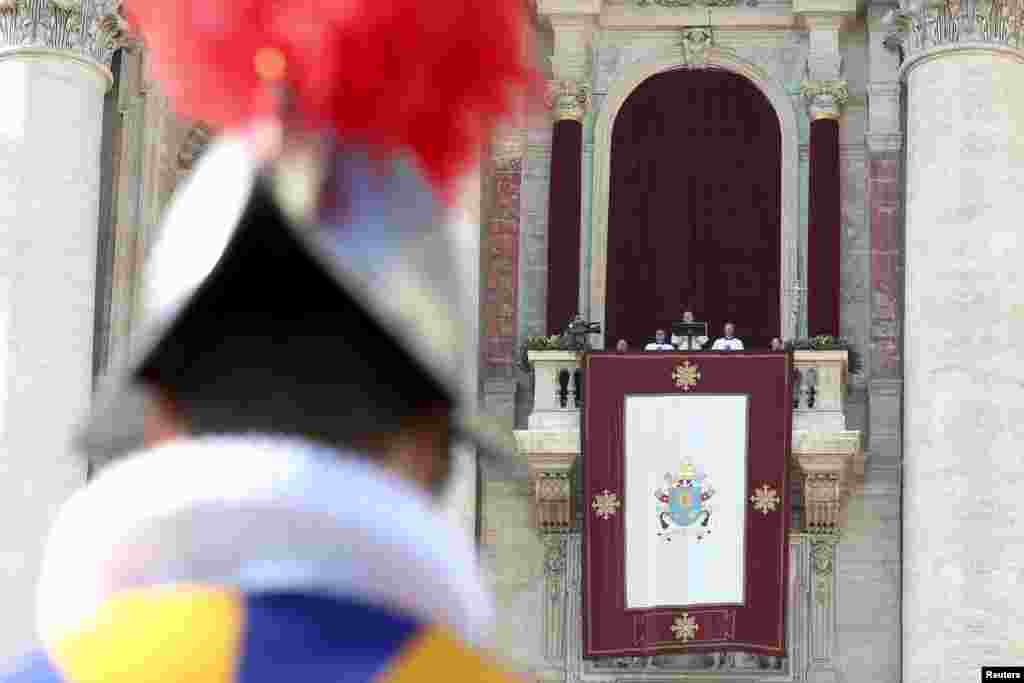 Pope Francis delivers a &quot;Urbi et Orbi&quot; (to the city and the world) message from the balcony overlooking St. Peter&#39;s Square at the Vatican.