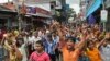 Bangladeshi garment workers shout slogans during a protest march in Narayanganj, near Dhaka, Sept. 25, 2013. 