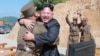 FILE - North Korean leader Kim Jong Un reacts with scientists and technicians of the DPRK Academy of Defense Science after the test-launch of the intercontinental ballistic missile Hwasong-14 in this undated photo released by North Korea's Korean Central News Agency.