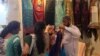 A Pakistani businessmen displaying his garments in New Delhi. (Anjana Pasricha/VOA)