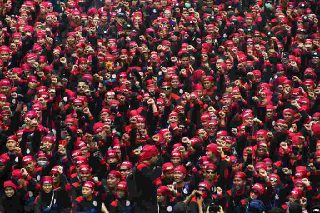 About 50,000 workers take part on a rally in Jakarta, Indonesia, demanding wage increases and to abolish the outsourcing system. 
