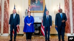 From left, Australian Minister of Defense Peter Dutton, Australian Foreign Minister Marise Payne, Secretary of State Antony Blinken, and Defense Secretary Lloyd Austin pose for a group photograph at the State Department in Washington, Thursday, Sept. 16, 