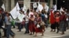 FILE - Hundreds of indigenous people, peasant farmers and activists demonstrate in the streets of Guatemala City, demanding the end of the corruption and the persecution of political leaders, May 8, 2019. 
