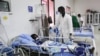 FILE - A doctor cares a patient who is infected with the COVID-19 in the Intensive Care Unit at Martini hospital in Mogadishu, Somalia, July 29, 2020.