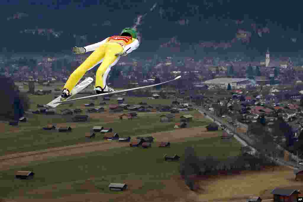 Slovenia's Peter Prevc soars through the air during his trial jump at the second stage of the 64th Four Hills Ski Jumping Tournament in Garmisch-Partenkirchen, Germany.