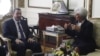 IMF Managing Director Christine Lagarde talks with Egypt's Prime Minister Hisham Qandil at the cabinet headquarters in Cairo, August 22, 2012.