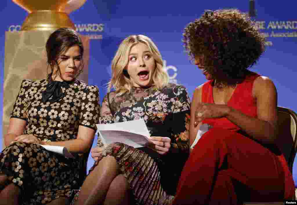 Actors America Ferrera, Chloe Grace Moretz and Angela Bassett (L-R) react as they look over notes before announcing the nominations for the 73rd annual Golden Globe Awards in Beverly Hills, California. The awards will be presented on Jan. 10, 2016.